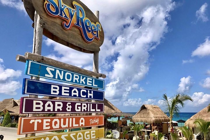 SkyReef beach club signs for snorkel, beach, bar and tequila